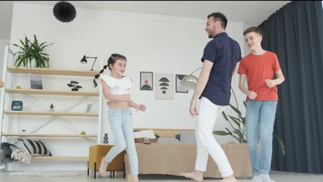 Father and Children Dancing at Home