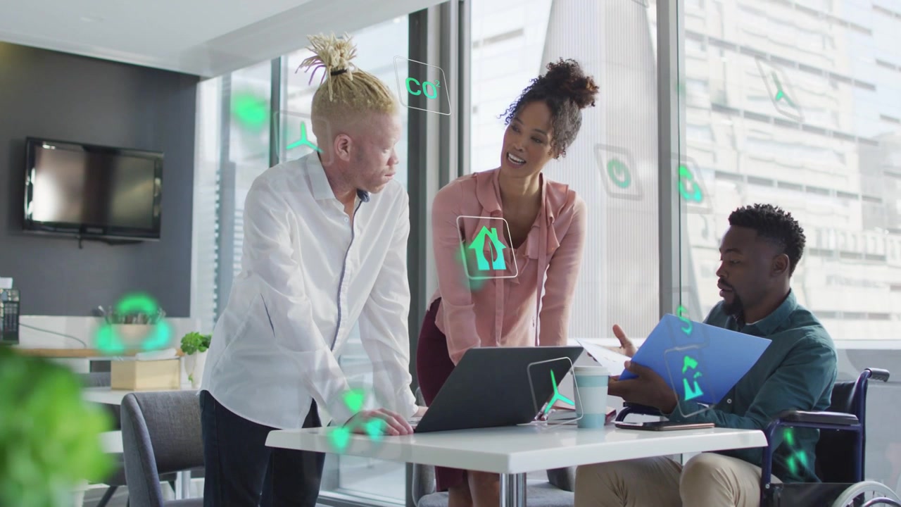 Team of three leaning over laptop woman pointing folder presenting business plan with AR icons