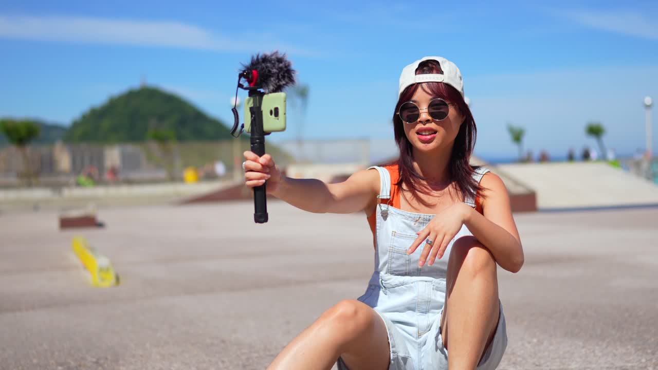 Young woman vlogging in the city