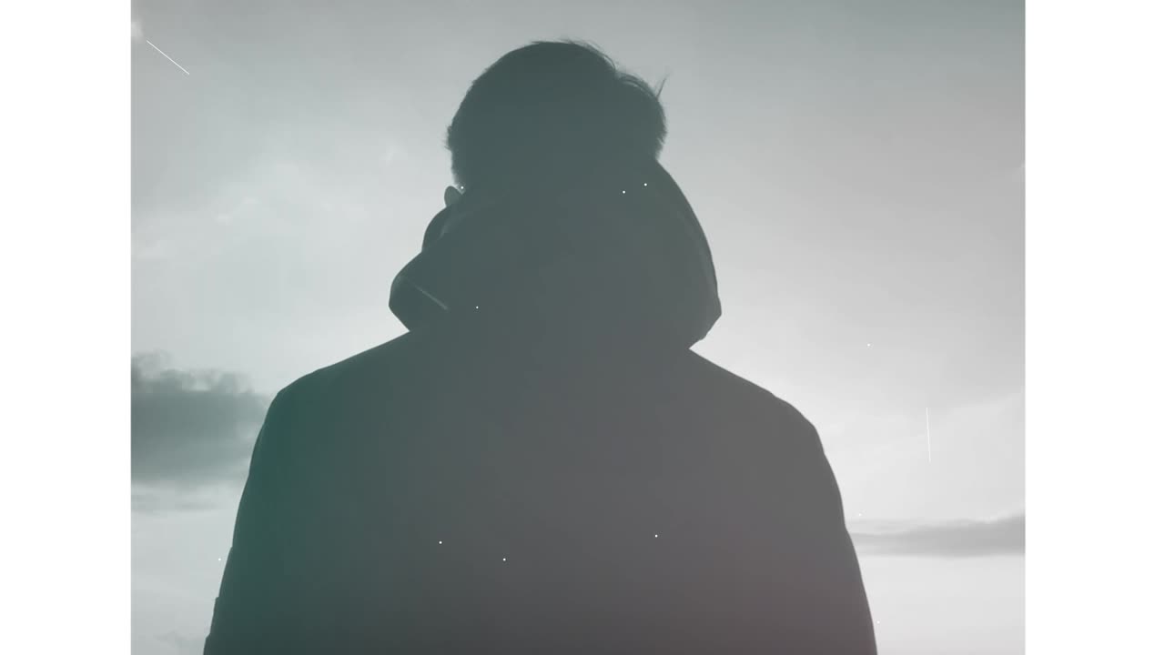 Silhouette of a Person Under a Starry Night Sky