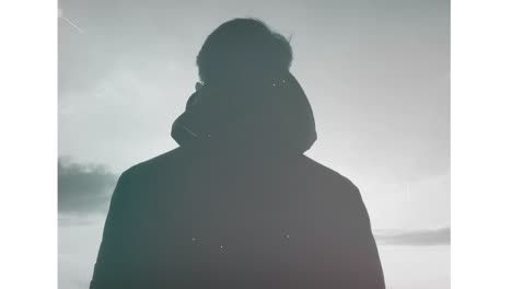 silhouette of a person under a starry night sky
