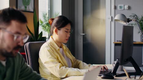 colleagues working in modern office