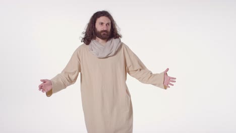 portrait of man wearing robes with long hair and beard representing figure of jesus christ with arms outstretched