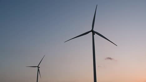 Wind-Turbines-Silhouette-against-the-Blue-sky-during-Sunset,-clean-alternative-energy-in-Thailand-and-mainland-Southeast-Asia