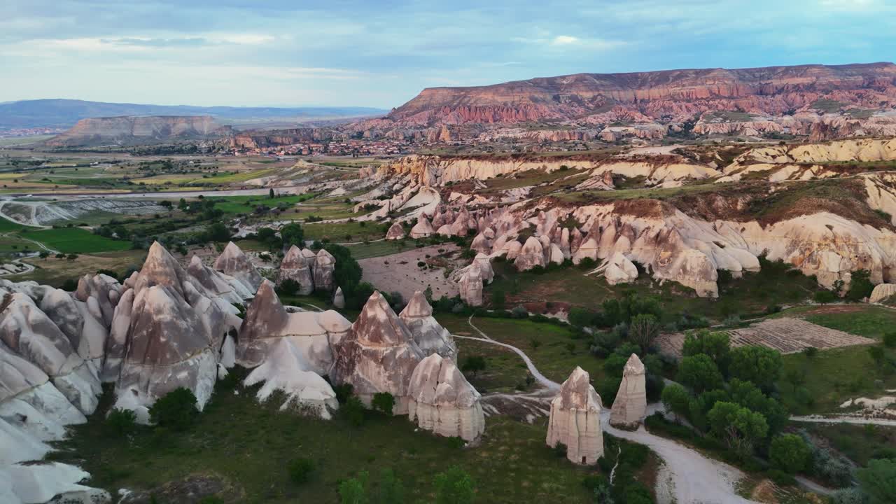 Cappadocia's unique rock formations at sunrise, showcasing natural beauty