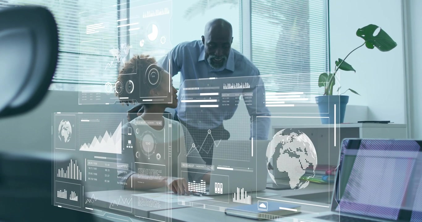 analyst typing on laptop, supervisor pointing at holographic charts and guiding business report