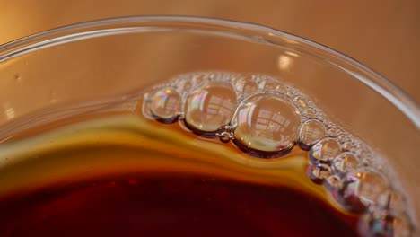 close up of bubbles in a cup of tea