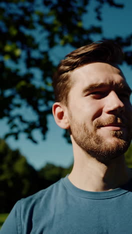 a man enjoying a sunny day outdoors in a park