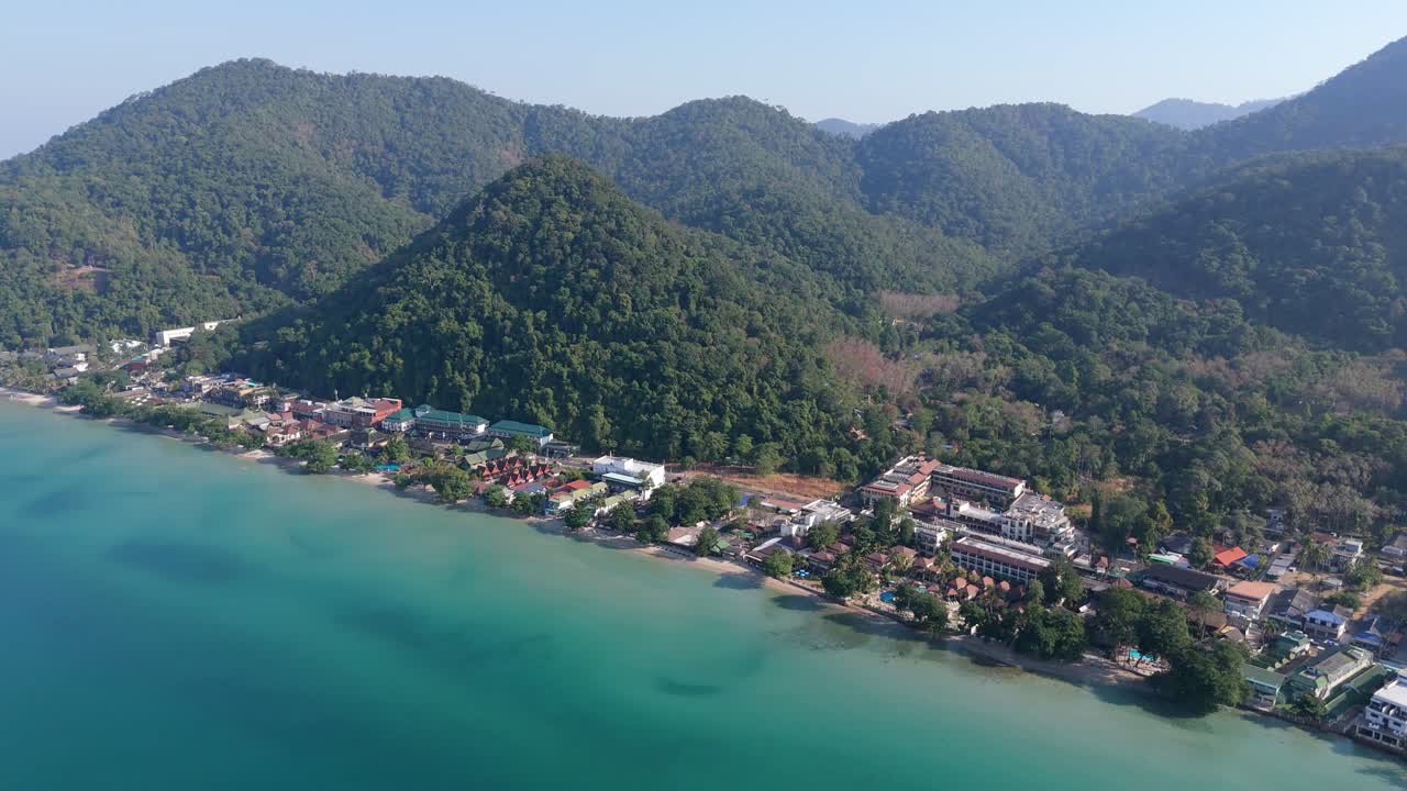 Stunning drone view of Hat Sai Khao village on Koh Chang, Thailand. Sunny morning aerial views of beaches, roads, and island landscapes