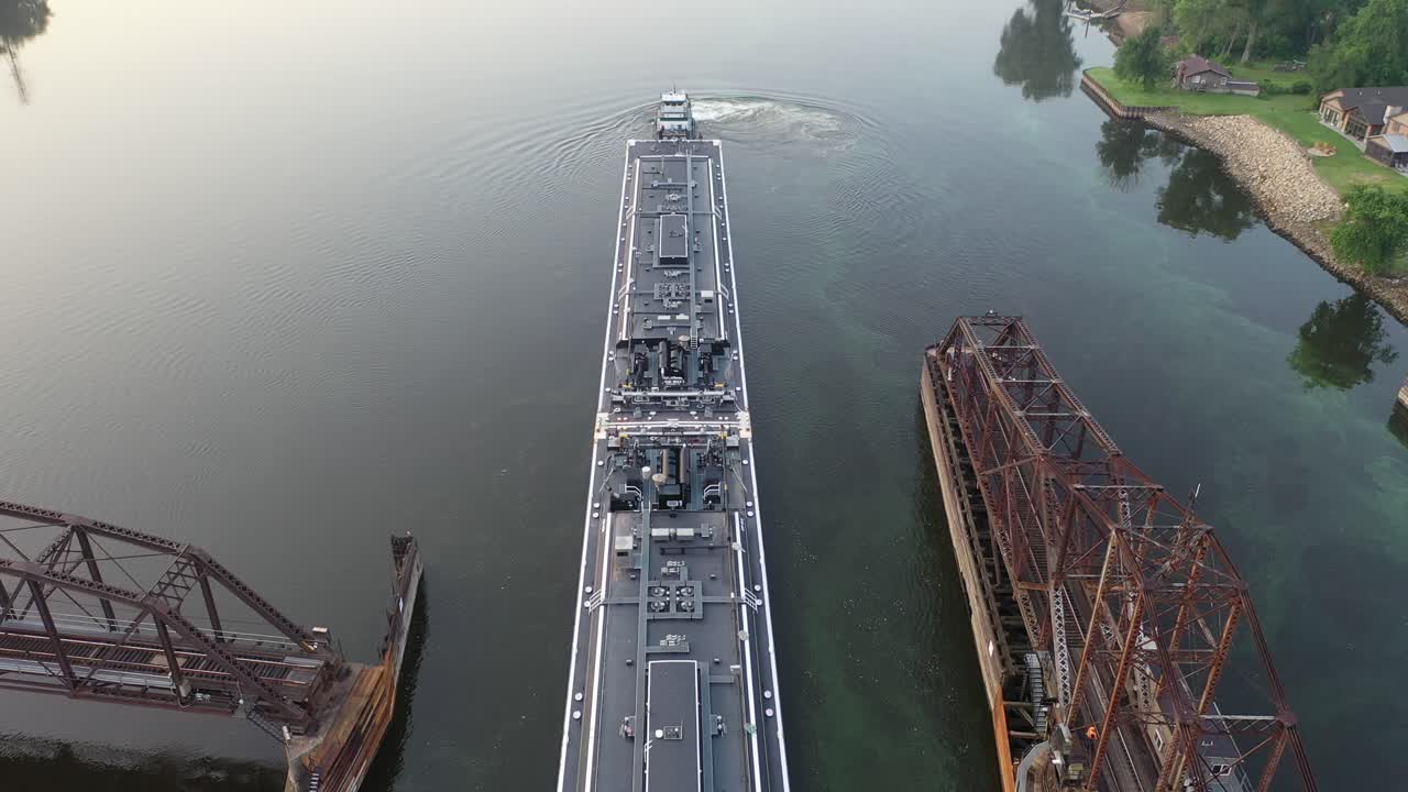 Barge Passing Under a Bridge
