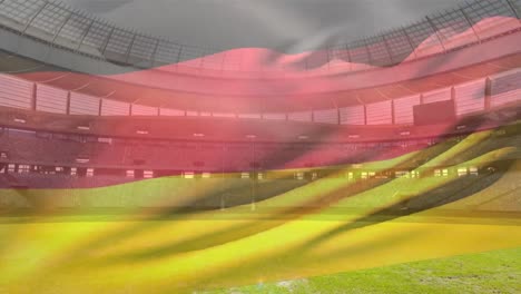 flag blowing in front of a stadium