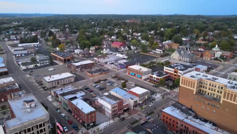 aerial view of downtown massillon, ohio at sunset featuring historic buildings and streets. crane down sunset ne