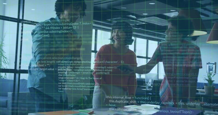 Team leaning over table pointing at documents, collaborating in business office with code overlay