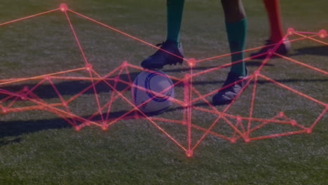 soccer player kicking ball with digital network animation over grassy field