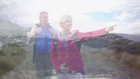 Happy-caucasian-senior-couple-hiking-in-countryside-pointing-the-way,-over-moving-landscape