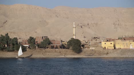 view of beautiful egyptian village from a nile river cruise