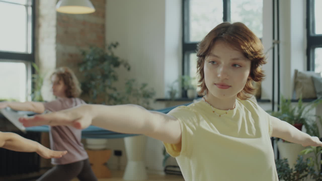 Girl Practicing Yoga on Group Class