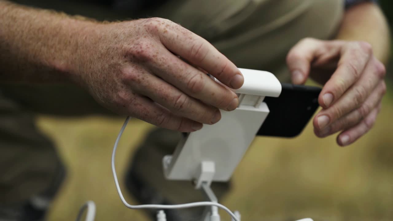 Attaching a smart phone to a drone controller
