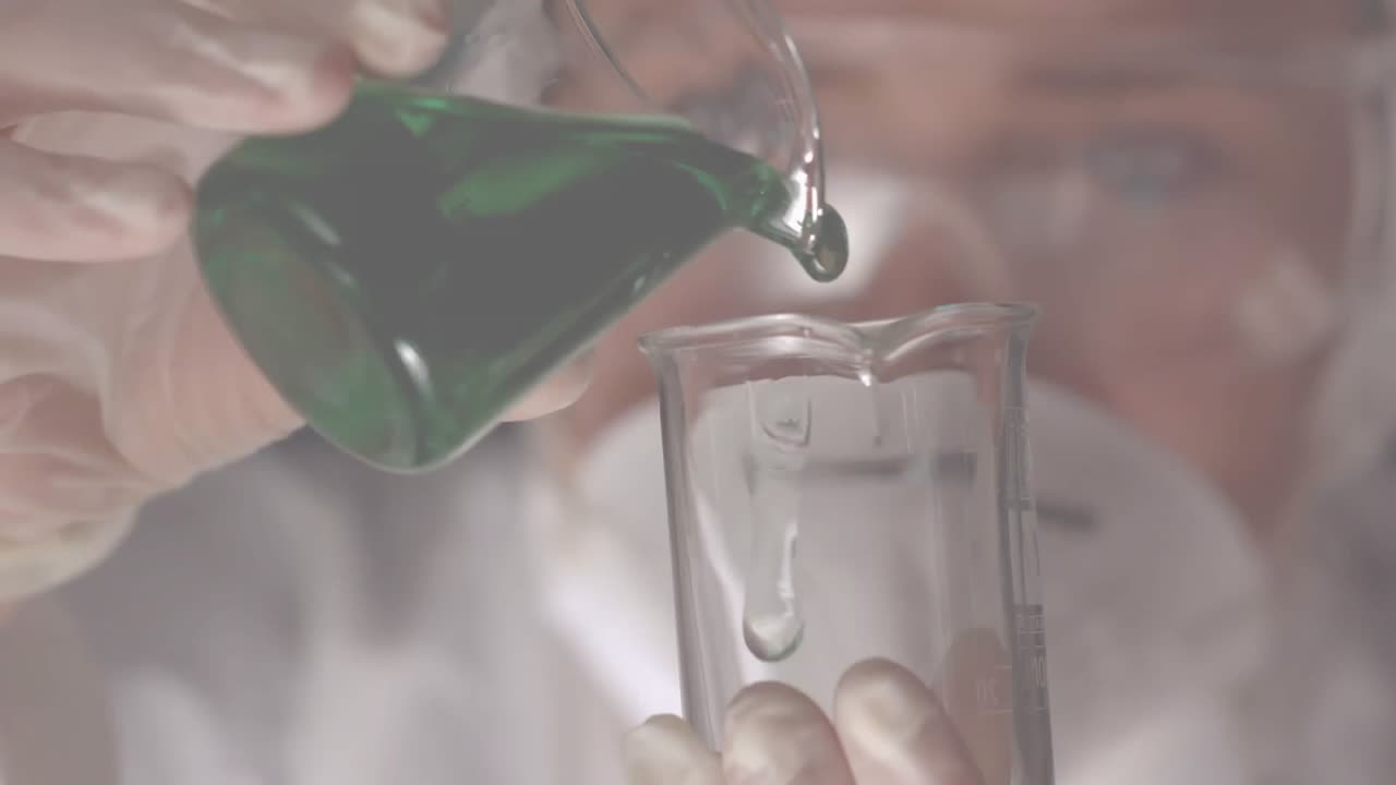 Woman wearing gloves pouring green solution into beaker in science lab showing red heart overlays