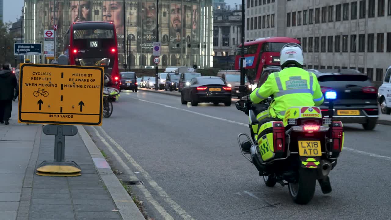 London Paramedic on Motorcycle in Busy City Traffic