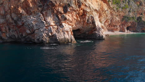 Aerial:-beautiful-coastal-caves-on-Croatia's-Adriatic-Sea-coastline
