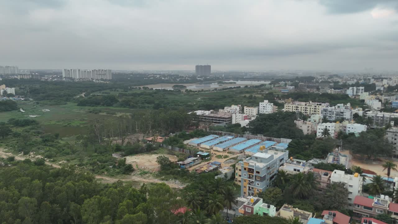 Drone view of a vibrant Bangalore suburb on a cloudy morning