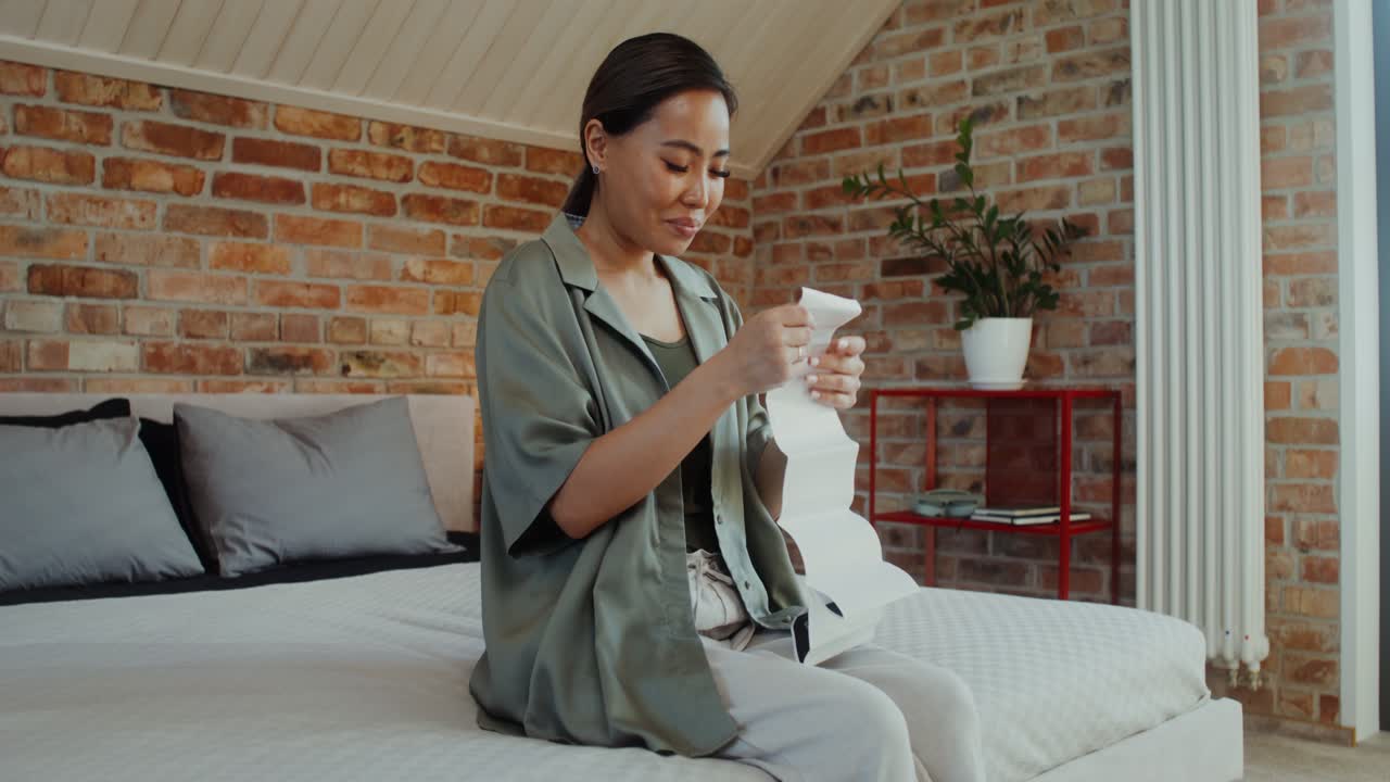 Woman Checking a Receipt