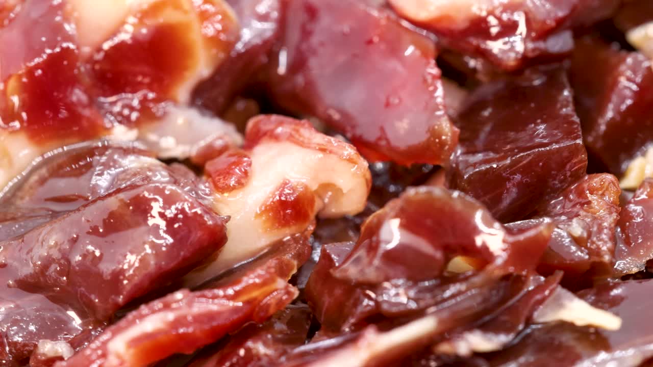 Spanish jamón ibérico small pieces, close up view in 4k