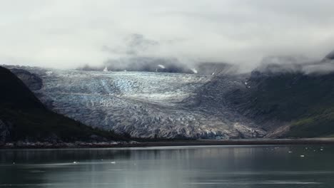 clouds over the mountains and the glacier in alaska