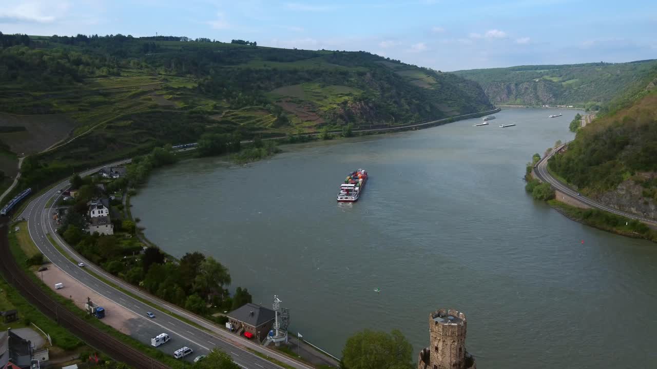 Multi-modal Transportation Along Rhine Valley, Road and Railway Trains With Cargo Ship on Waterway