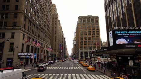 moving shot of nyc new york city manhattan iconic street with skyscrapers and taxis