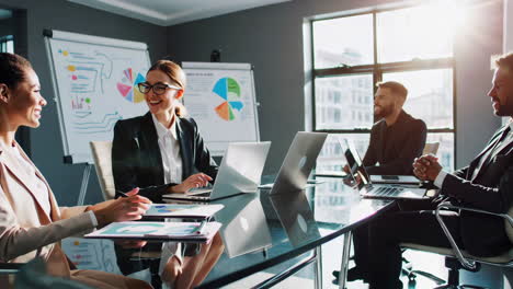 business professionals collaborating in a modern office meeting