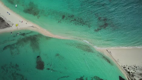 A-beautiful-sandbar-surrounded-by-turquoise-waters-at-cayo-de-agua,-aerial-view