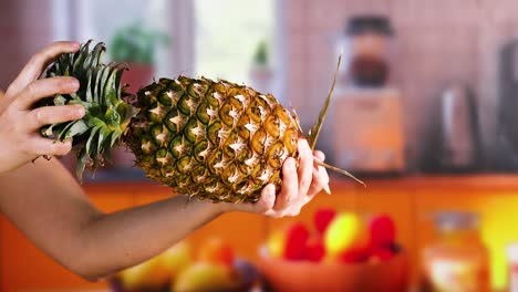 woman holding a pineapple in a kitchen