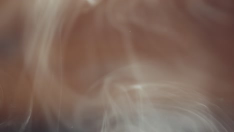 smoke swirling and looping on brown background