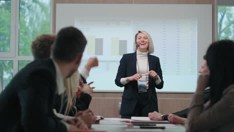 female financial expert is speaking in conference and communicating with audiences