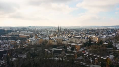 drone shot of luxembourg city one snowy day in winter