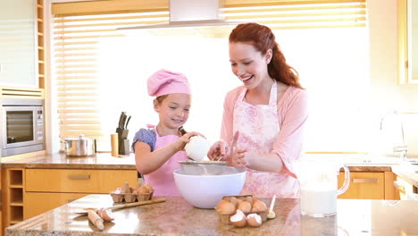 mother and daughter cooking