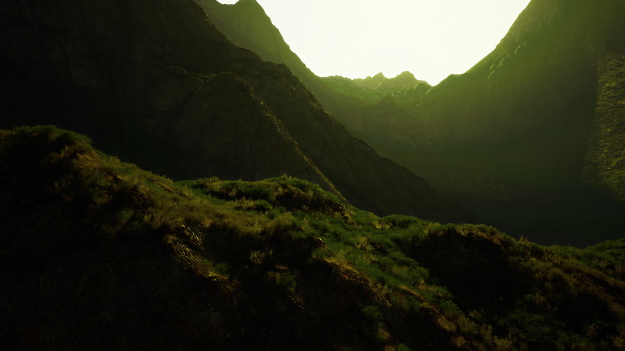 Majestic mountain landscape at sunrise revealing lush greenery and peaks