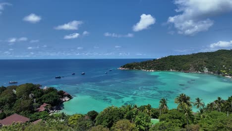panning shot of beautiful paradise town by stunning blue ocean, thailand village