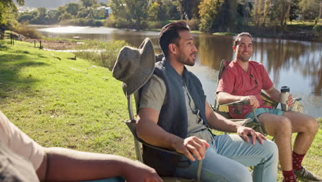 Friends,-talking-and-camping-chair-in-nature