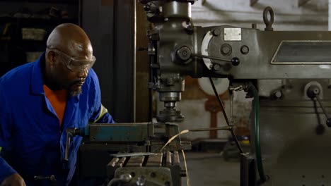 metalsmith working in workshop 4k