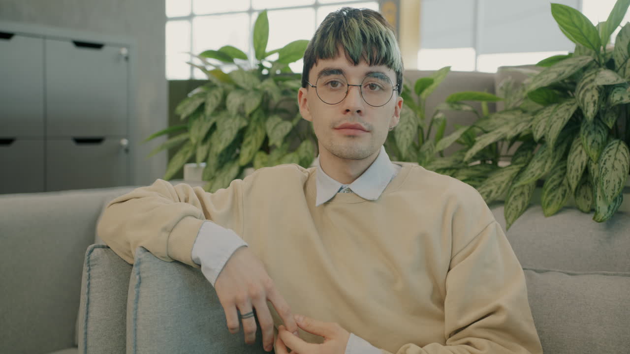 Young Man Sitting on a Couch