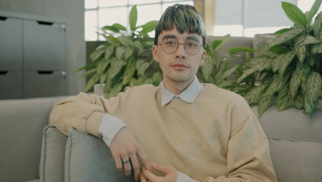 young man sitting on a couch