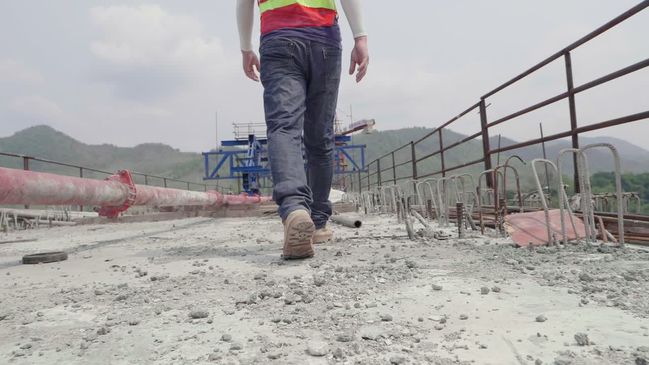 Construction Worker on Bridge Under Construction