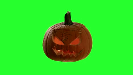 elemento de fondo de halloween en la calabaza clave de croma con una talla de cara espeluznante