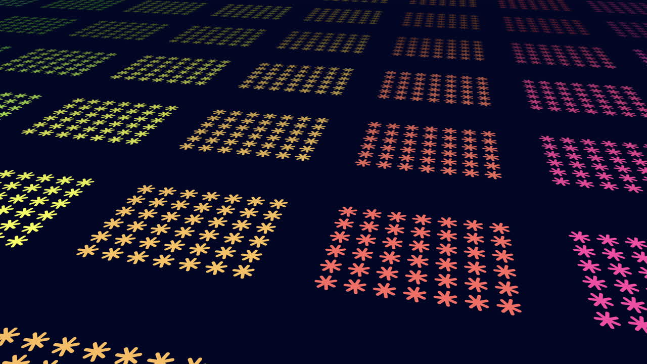 Abstract footage of repeating flower-like symbols arranged in colorful square tiles on a dark blue background, creating a modern geometric pattern for design and tech visuals