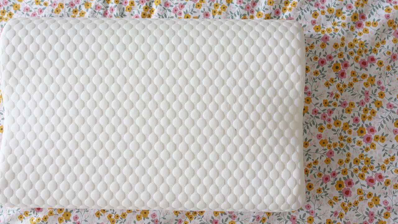 White Memory Foam Pillow on Floral Bedding
