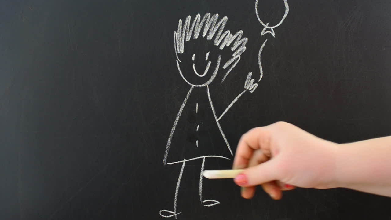 The girl with a dog. We draw chalk on a board