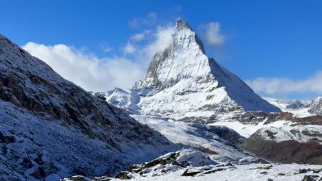 Lake-Riffelsee-Zermatt-Switzerland-Glacier-Gornergrat-Railway-train-stop-autumn-October-clear-afternoon-blue-sky-The-Matterhorn-peak-ski-resort-first-snow-landscape-scenery-Swiss-Alps-slider-right